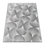 A soft, light gray foam rug with a modern pattern