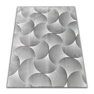 A soft, light gray foam rug with a modern pattern