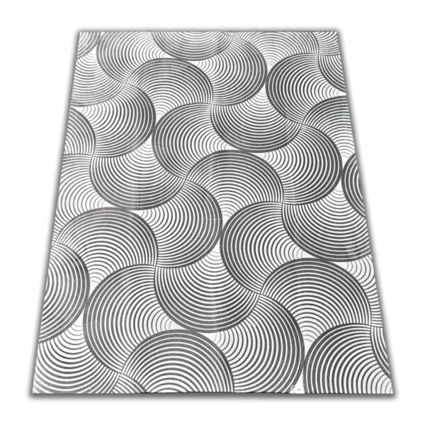 A soft, light gray foam rug with a modern pattern