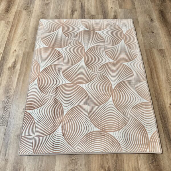 A soft, light beige foam rug with a modern pattern