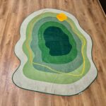 A soft green rug in an unusual shape