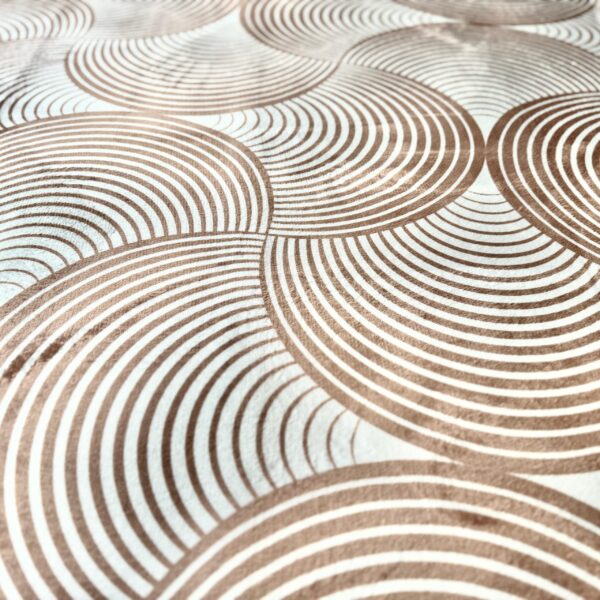 A soft, light beige foam rug with a modern pattern