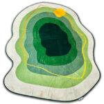 A soft green rug in an unusual shape