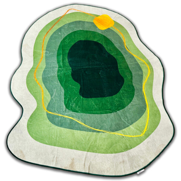 A soft green rug in an unusual shape