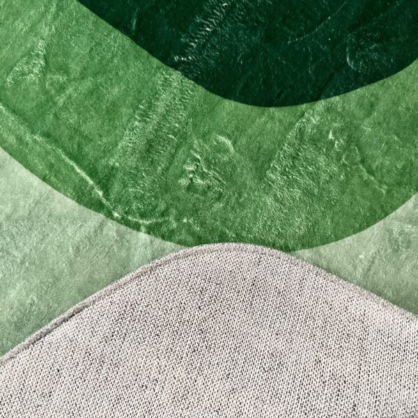 A soft green rug in an unusual shape