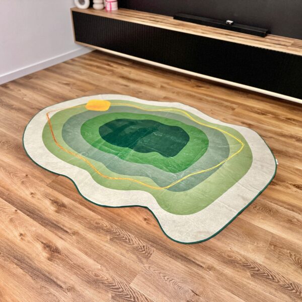 A soft green rug in an unusual shape